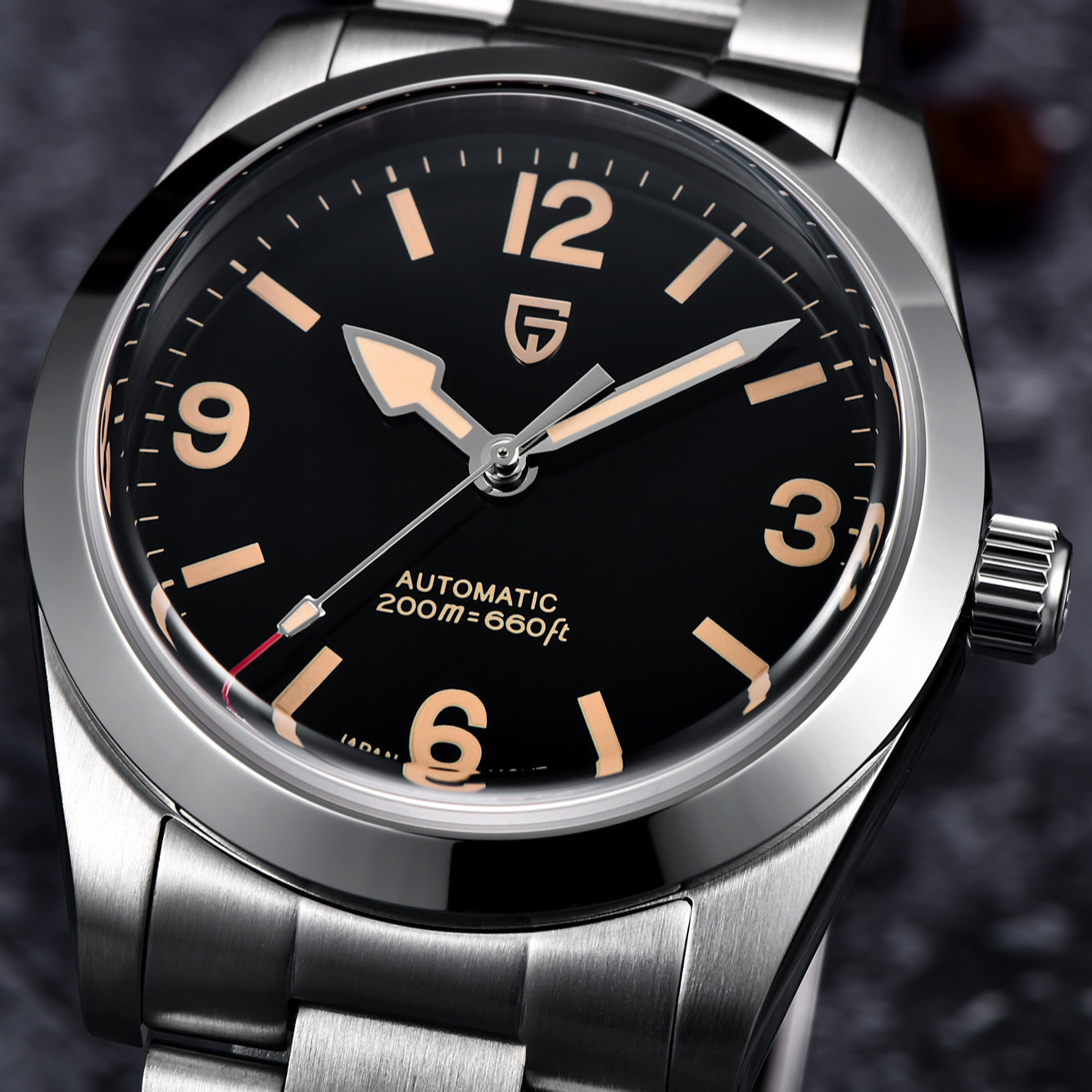 Silver watch with black dial and brand logo on a dark background