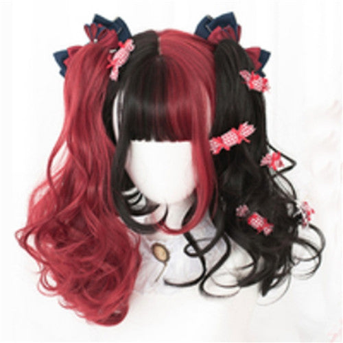 Black and red wig with hair clips on a white background