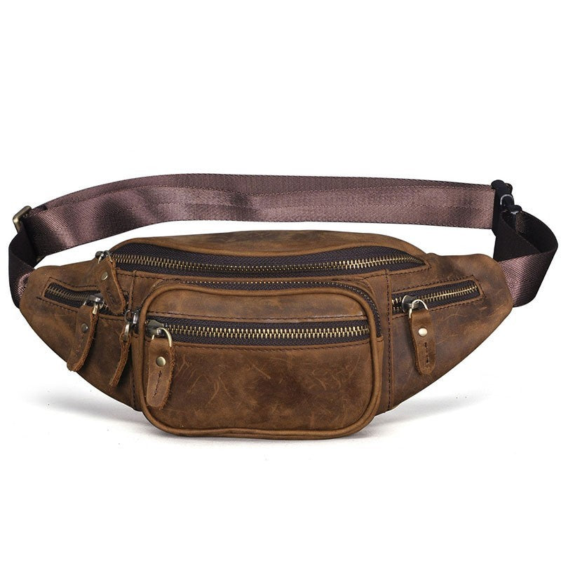 Brown leather waist bag with multiple zippers on a white background