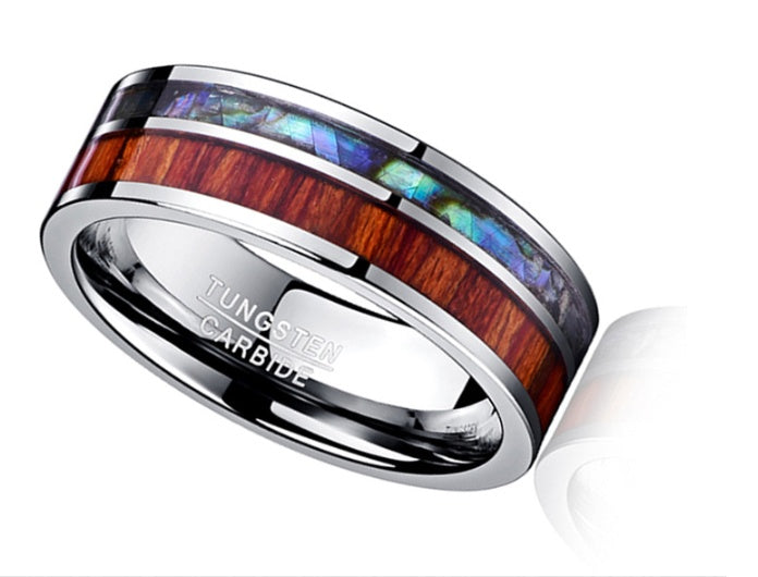 Tungsten carbide ring with wood and opal inlay on a white background