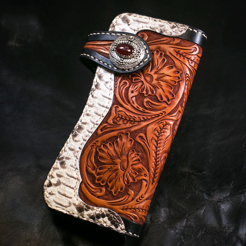 Handcrafted leather wallet with intricate designs and a concho on a dark background