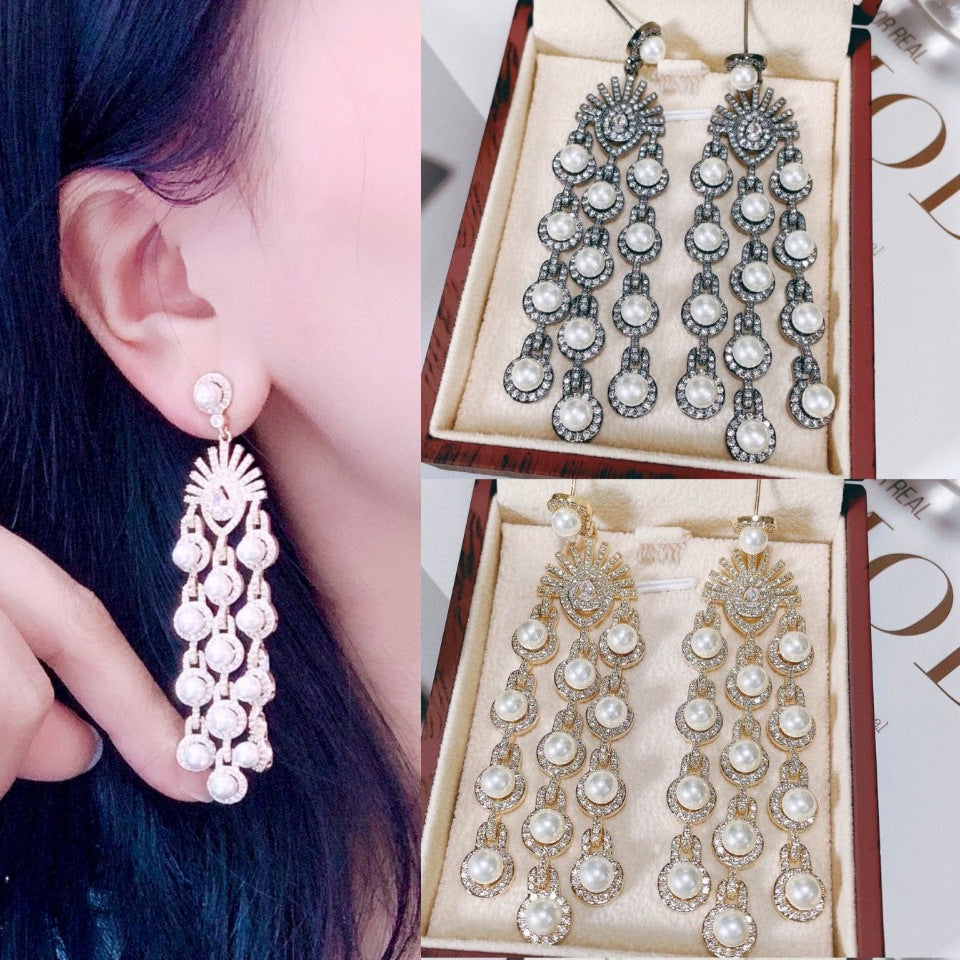 Collage of pearl earrings with close-up on an ear and in a box.