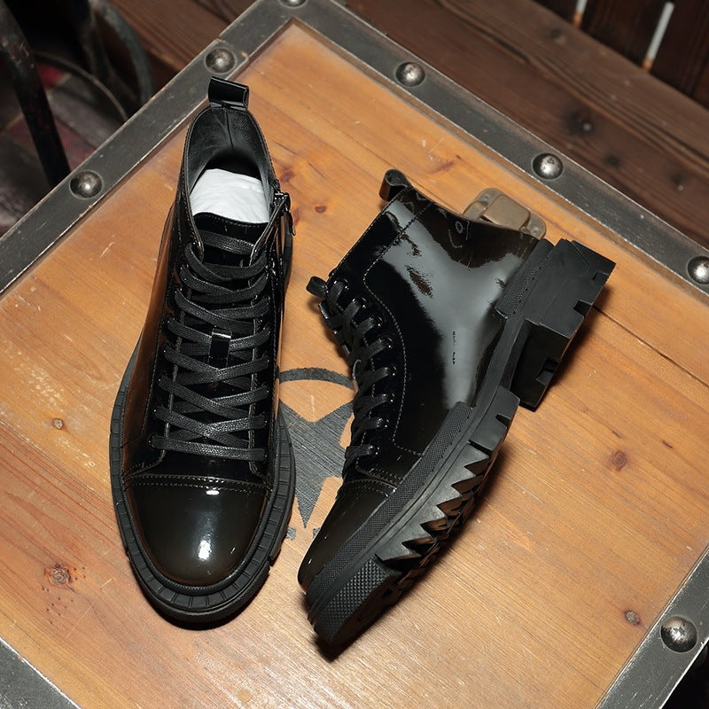 Black high-top sneakers on a wooden surface