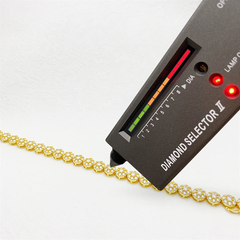 Diamond selector II tool with a gold chain on a white background
