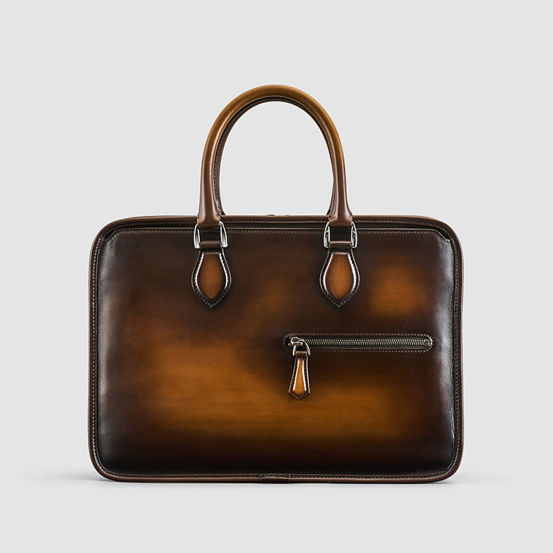 Brown leather briefcase with a zipper on a light gray background