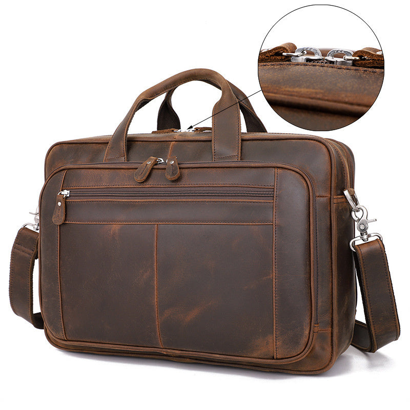 Brown leather briefcase with a close-up inset showing texture details on a white background