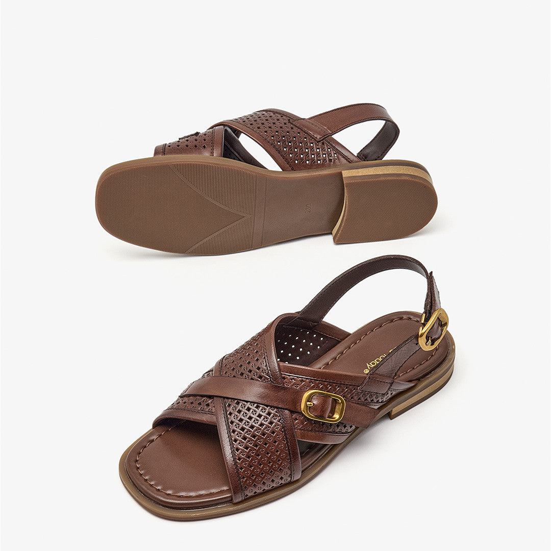 Brown sandal with a buckle on a white background