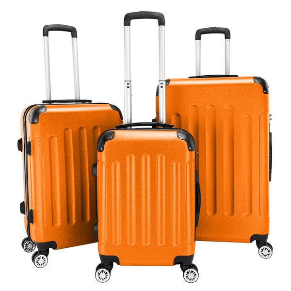 Three orange suitcases of different sizes on a white background