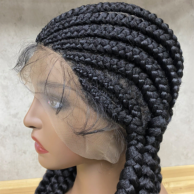 Black braided wig on a mannequin head with a neutral background