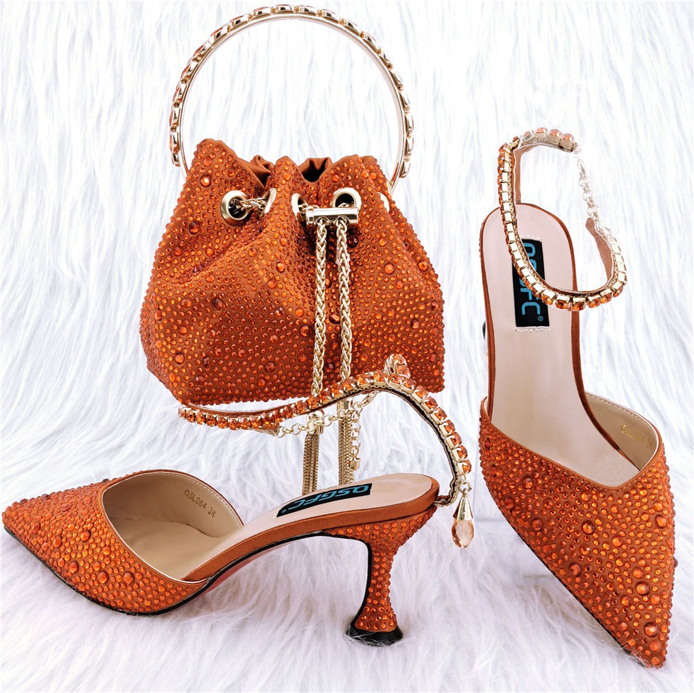 Orange studded handbag and high-heeled shoes on a white background
