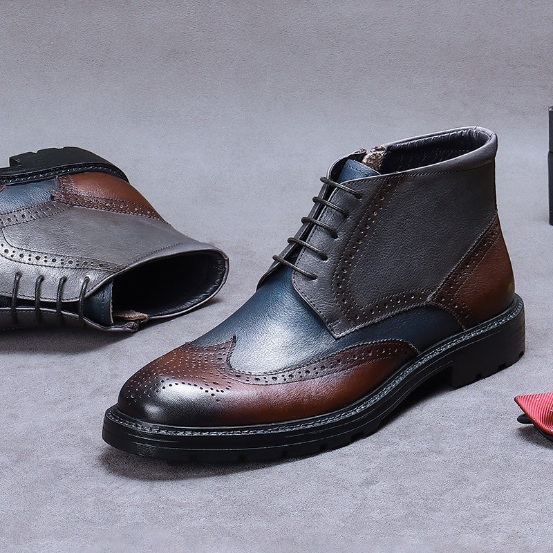 Pair of brown and black leather dress shoes on a gray background