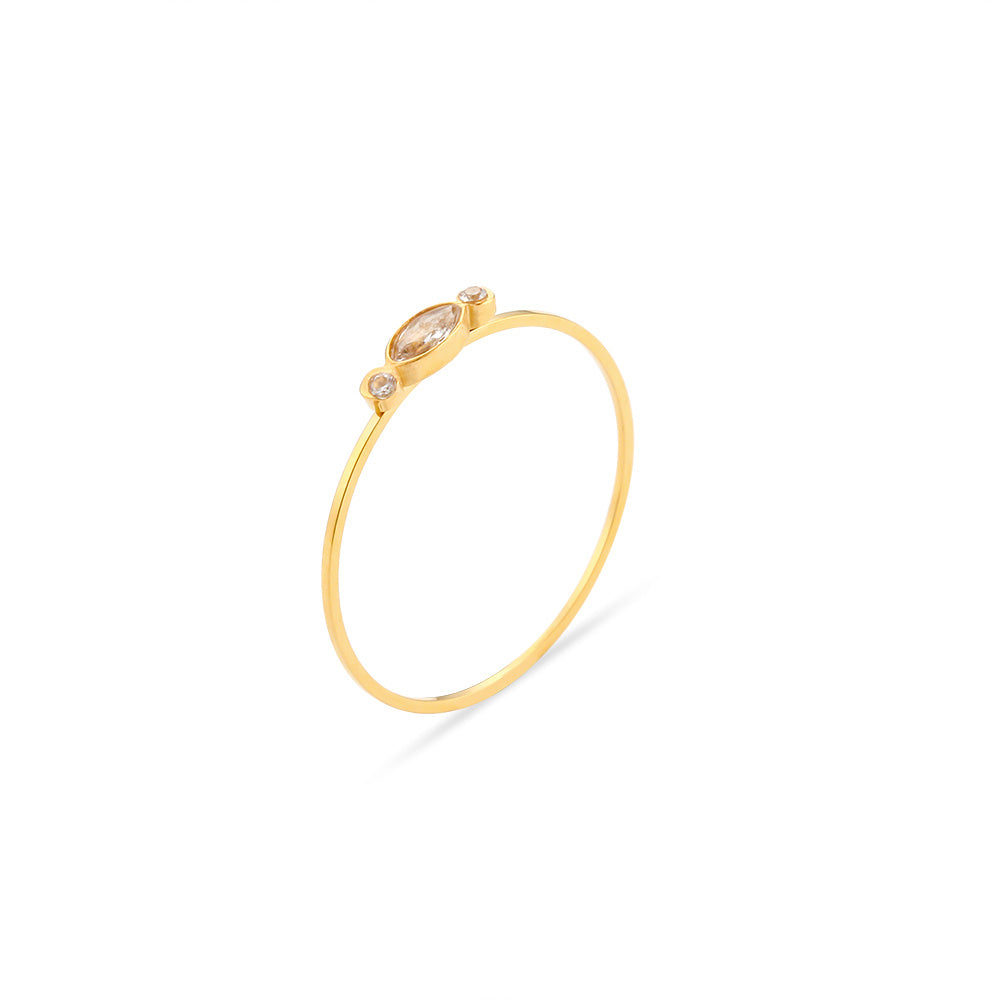 Gold ring with small gemstones on a white background