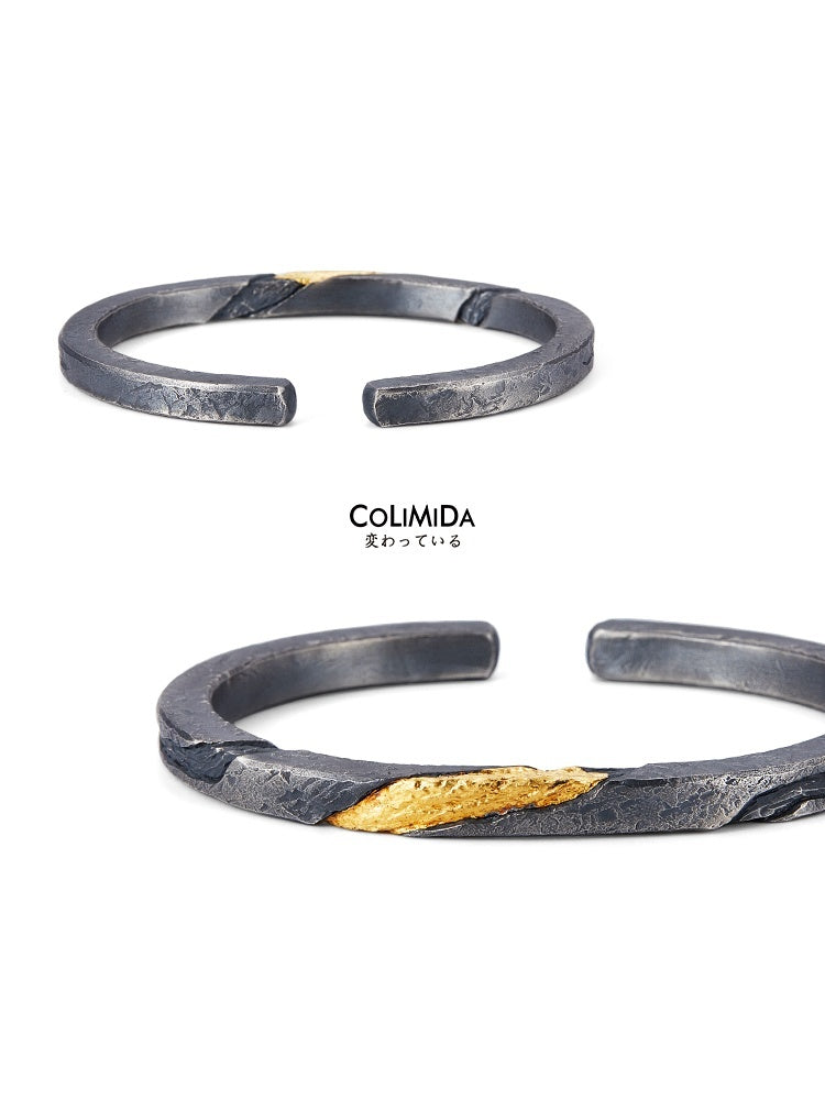 Black and gold bracelet with 'COLIMIDA' branding on a white background