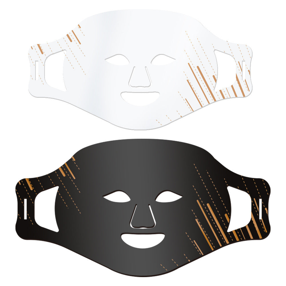 Black and white face masks with decorative patterns on a white background