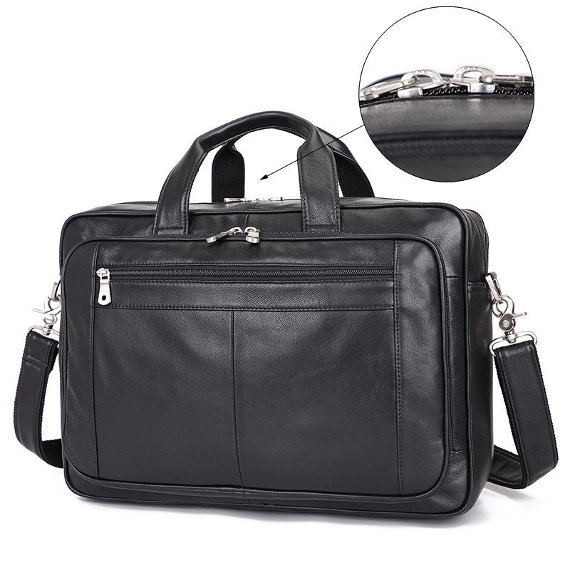 Black leather briefcase with multiple zippers on a white background
