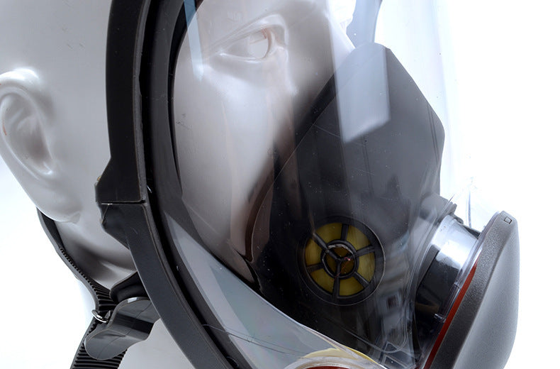 Close-up of a futuristic helmet with a clear visor on a white background