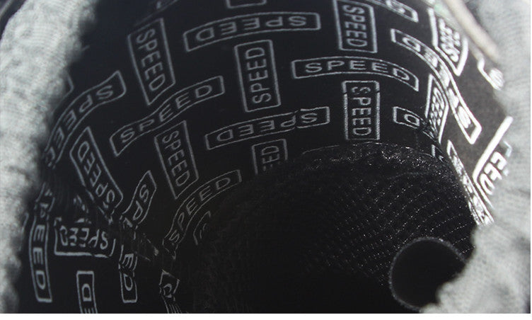 Close-up of a tire with 'SPEED' branding on a blurred background