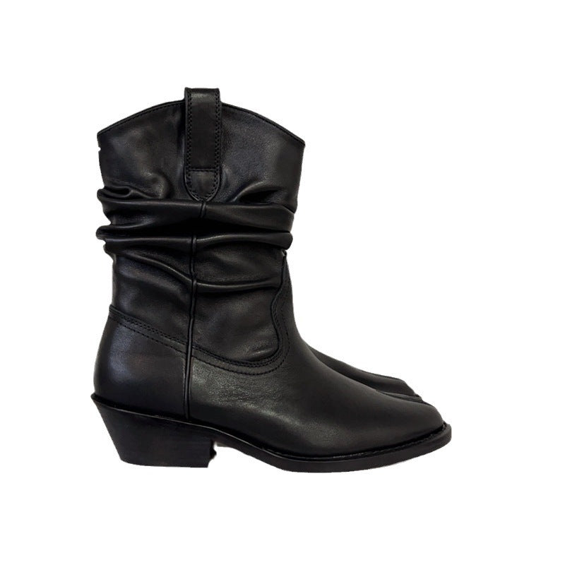 Black leather boot on a white background
