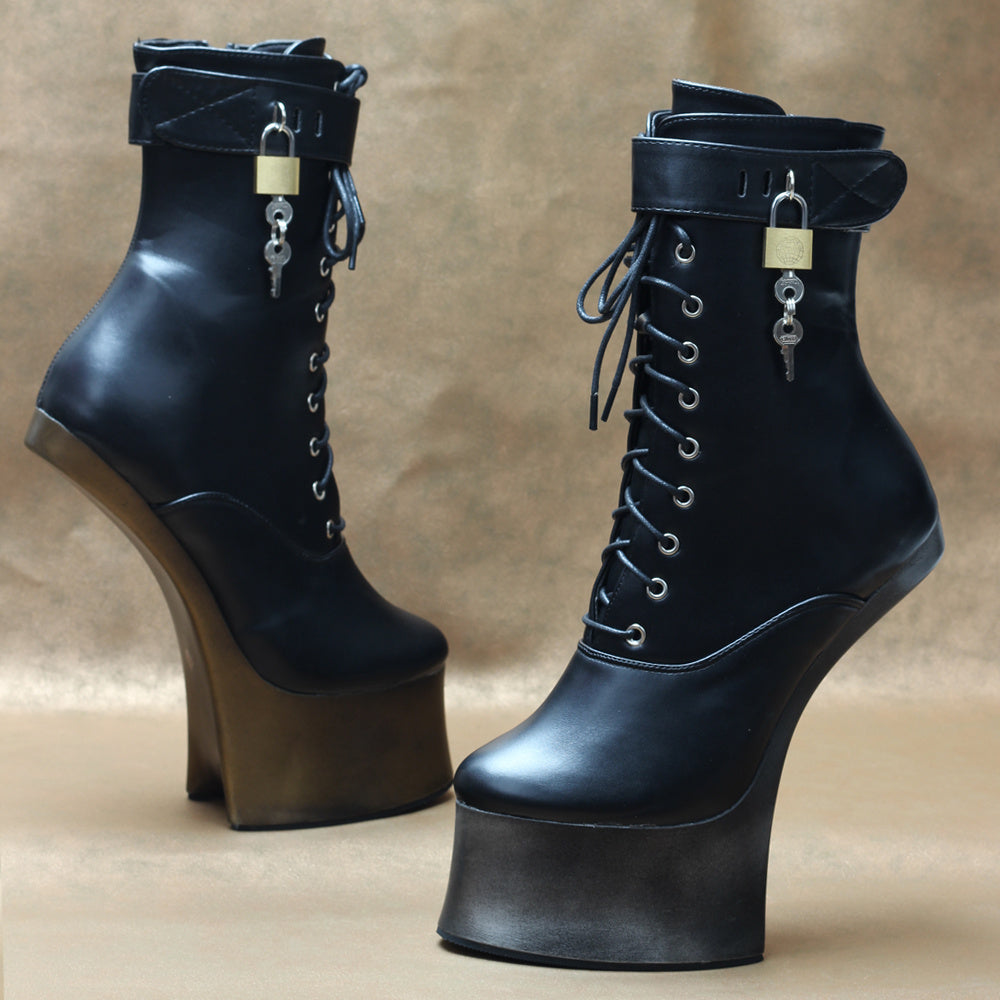 Black high-heeled boots with lock and key charms on a beige background