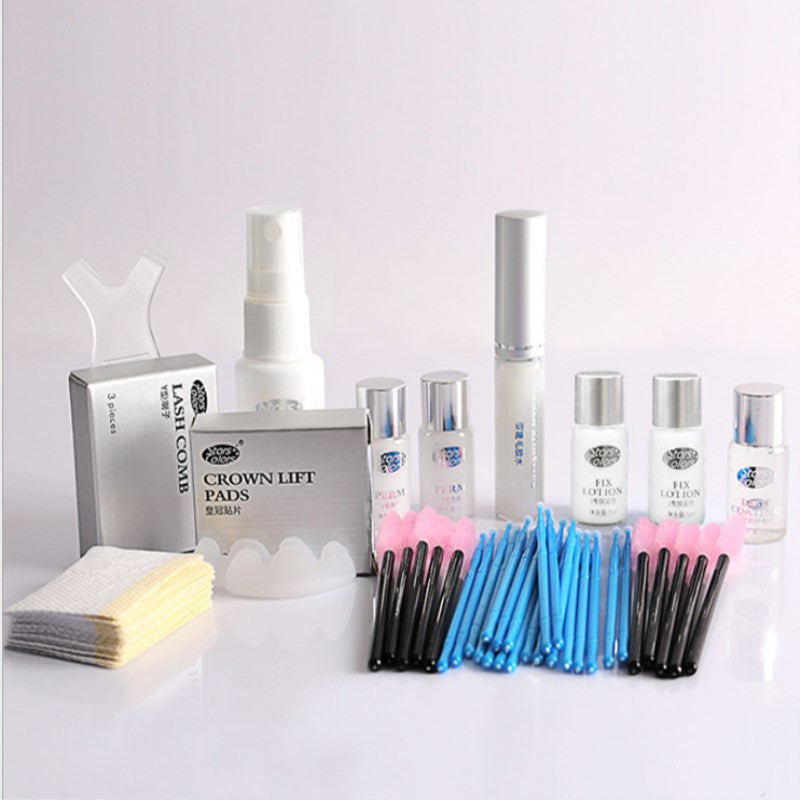 Collection of skincare products and tools on a light gray background