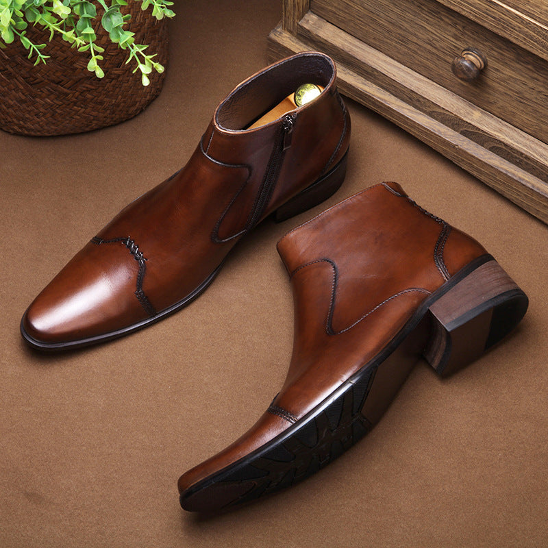 Pair of brown leather shoes on a brown surface with a wooden drawer and plant in the background.