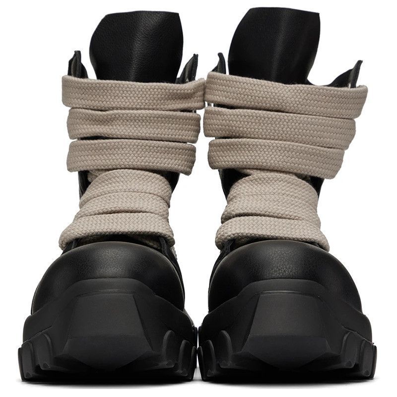 Black and beige high-top sneakers with thick soles on a white background