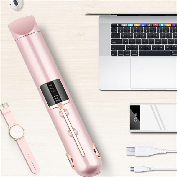 Pink electronic device with screen, USB cable, and watch on a light surface