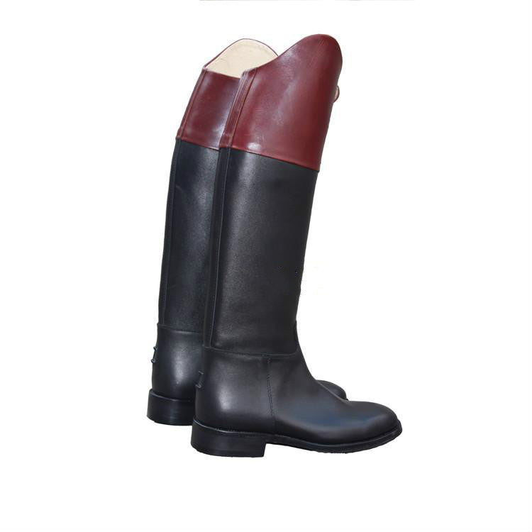 Black riding boot with a maroon top on a white background