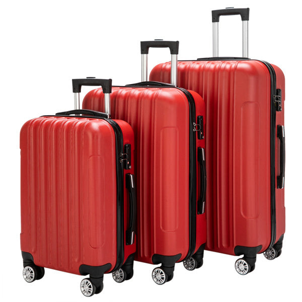 Set of red suitcases with black handles and wheels on a white background