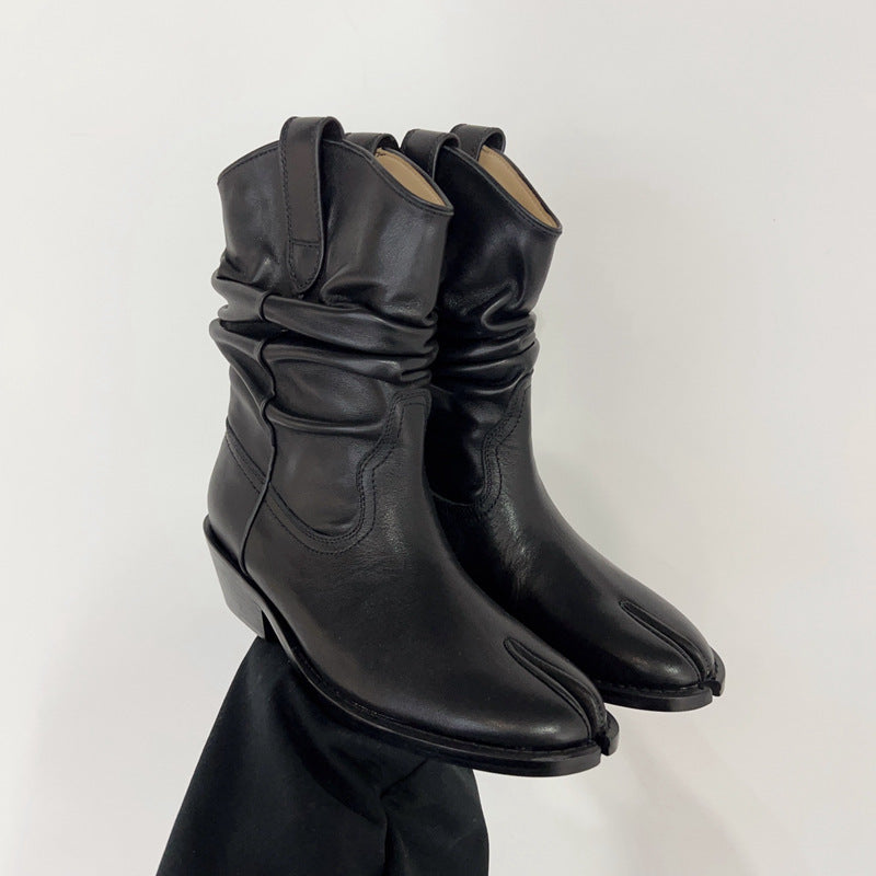 Pair of black leather boots on a white background
