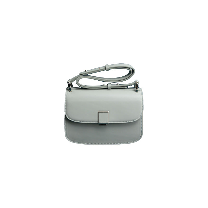 Light gray handbag with a strap on a white background