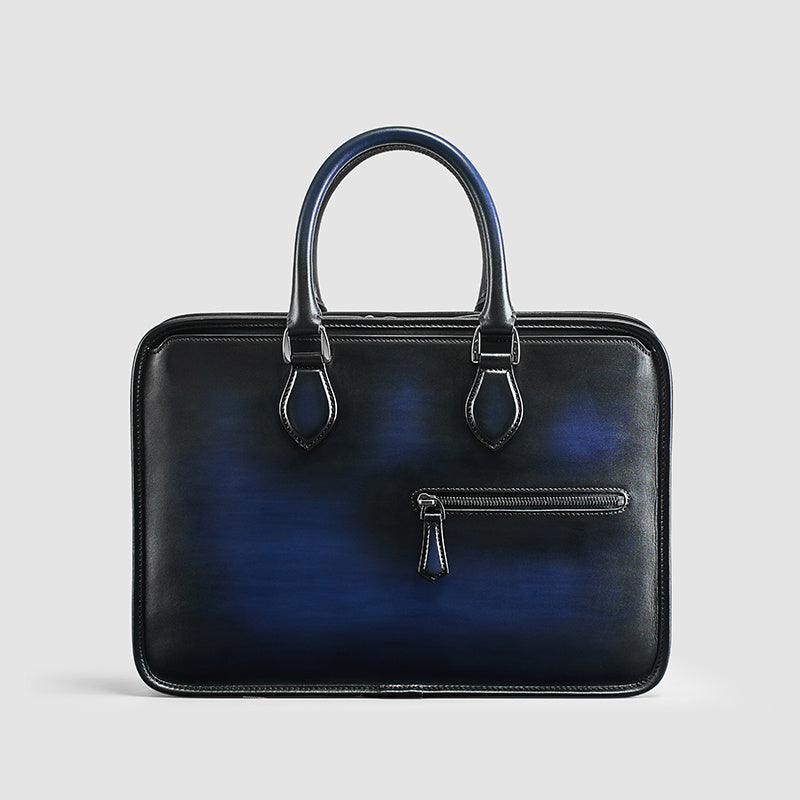 Black and blue leather briefcase on a light gray background
