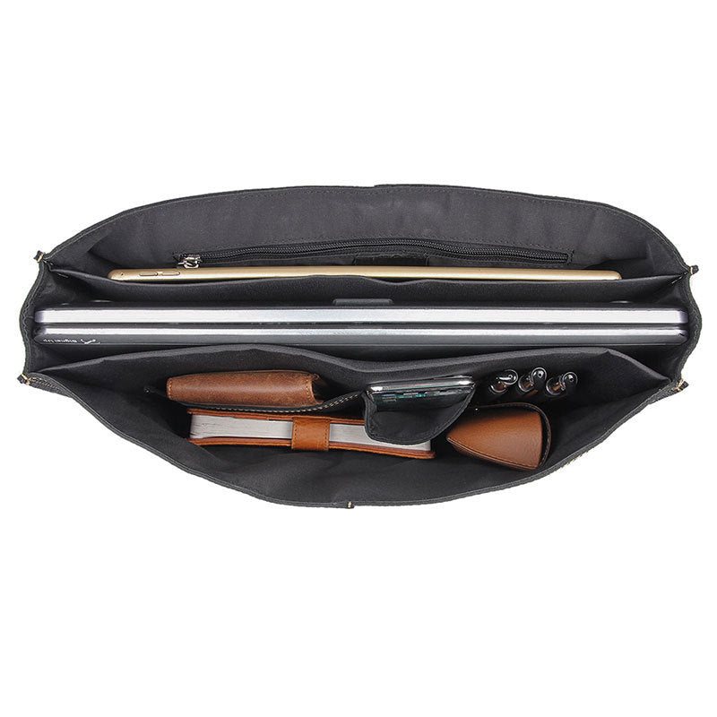 Black briefcase with compartments and a handle on a white background