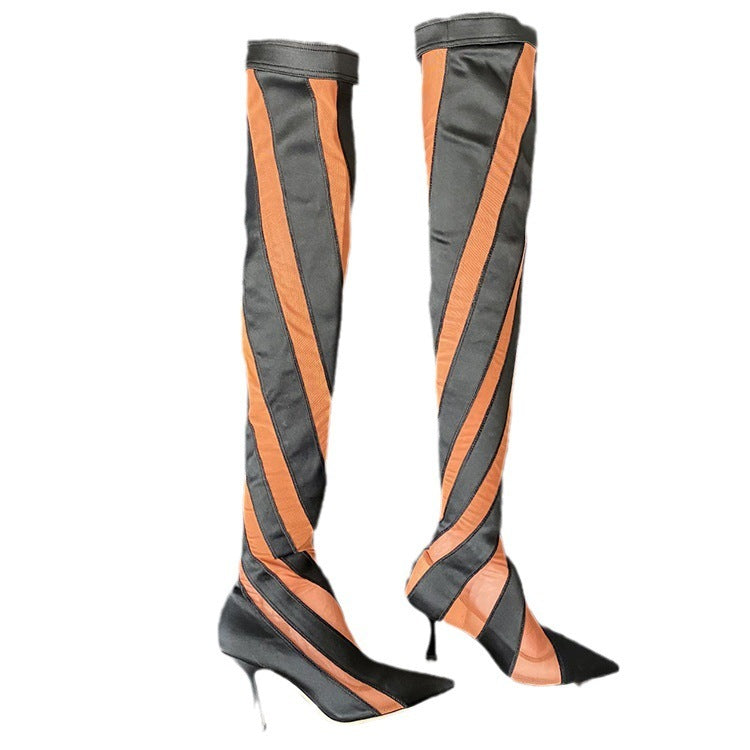Black and orange striped knee-high boots on a white background