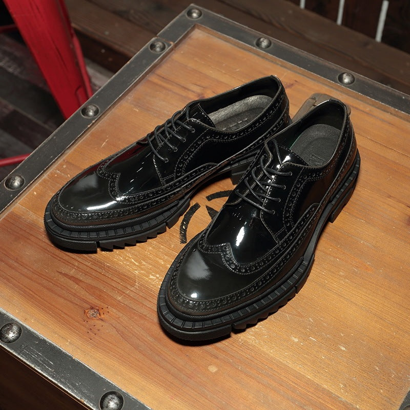 Black glossy shoes on a wooden surface with metal accents