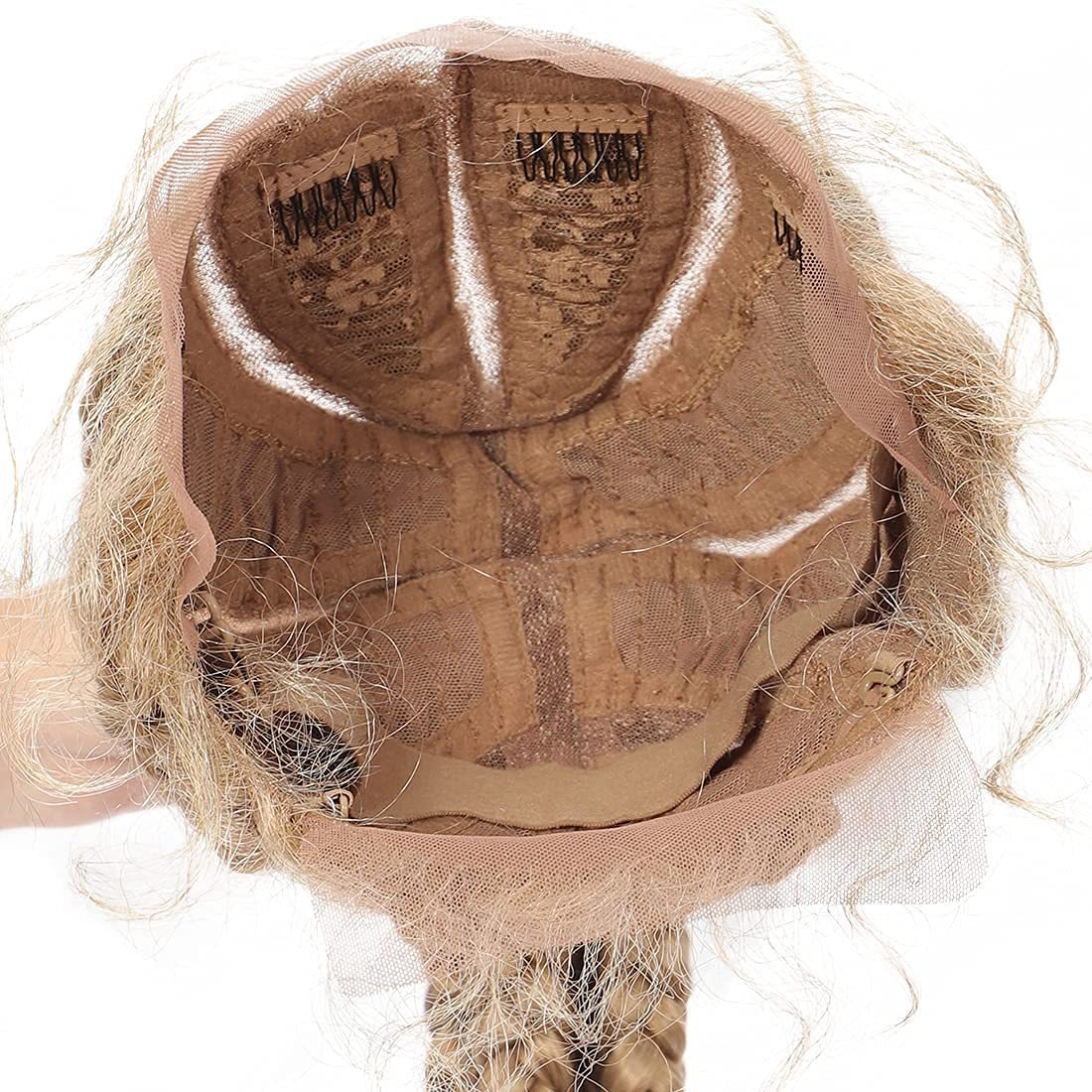 Close-up of a wig cap with hair strands on a white background