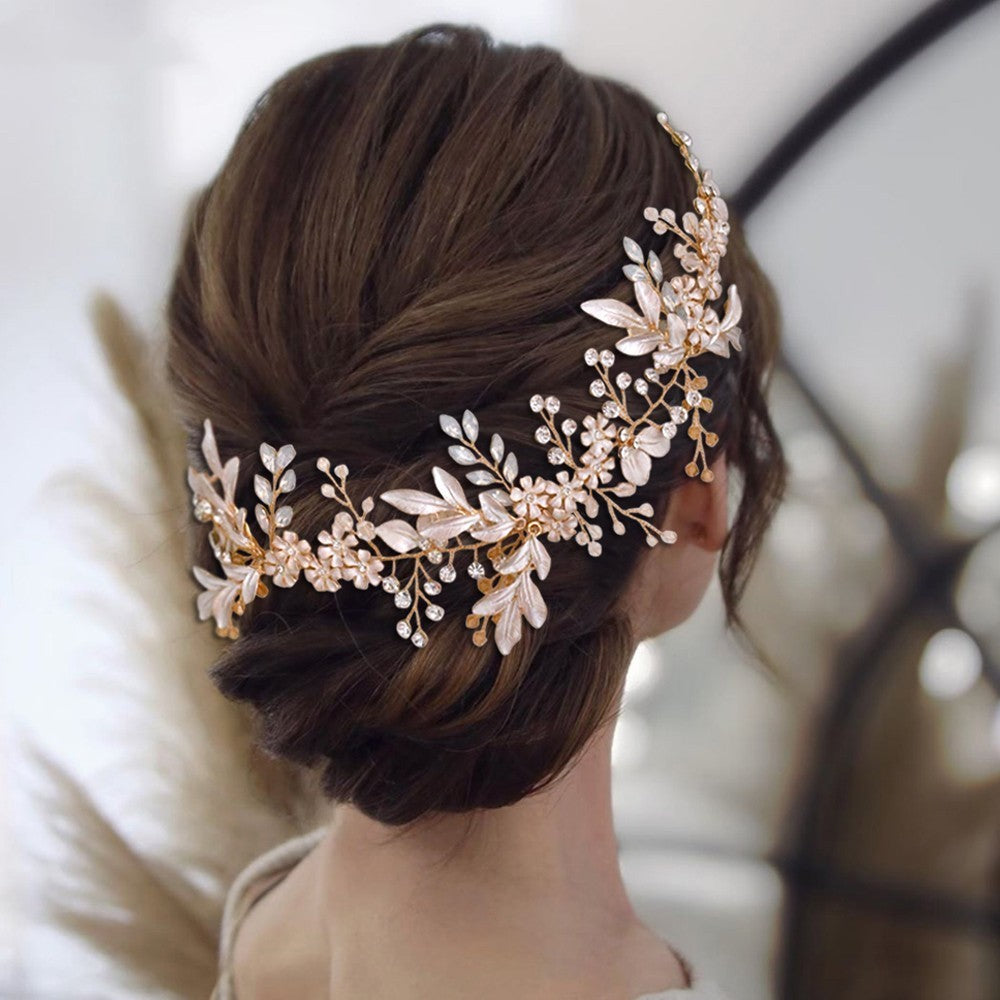 Woman wearing a decorative headpiece with floral details on a blurred background