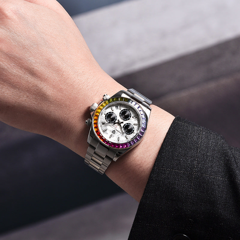 Close-up of a wrist wearing a silver watch with a colorful bezel against a blurred background
