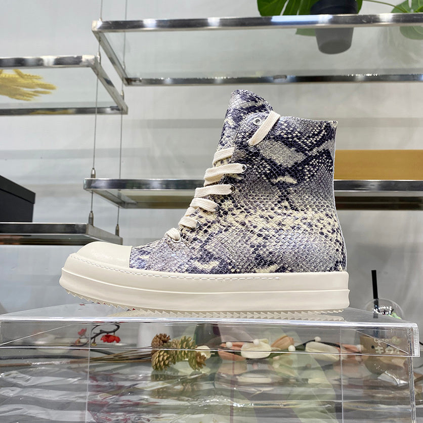 High-top sneaker with snake print on a clear shelf