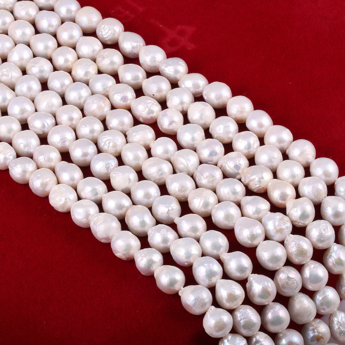String of white pearls on a red background