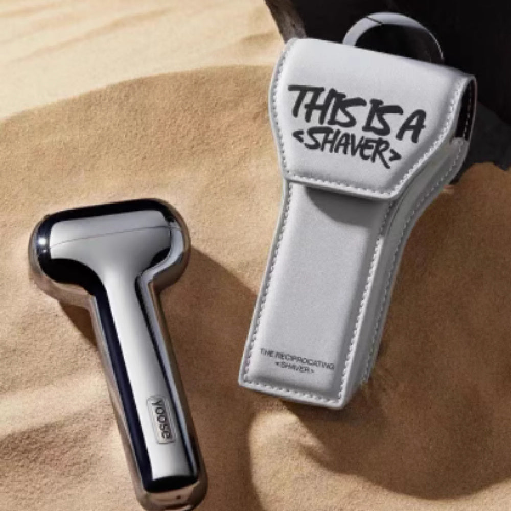 Shaver and its carrying case on a wooden surface