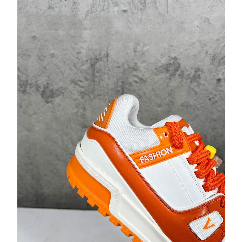 Orange and white sneaker with 'FASHION' text on a gray background