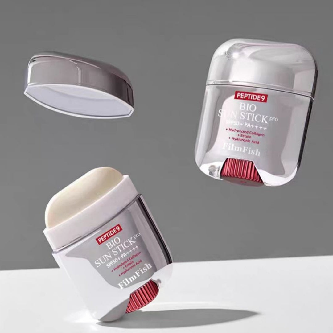 Sun stick with visible brand name on a gray background