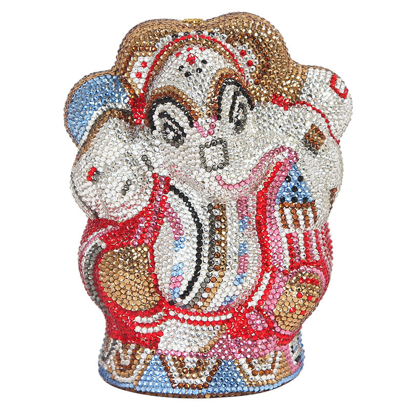 Decorative bear figurine with colorful gemstones on a white background