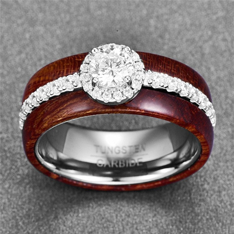 Two rings with wooden and metal bands on a gray background