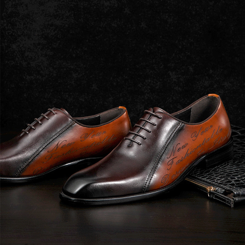 Pair of brown leather dress shoes with black soles on a dark background