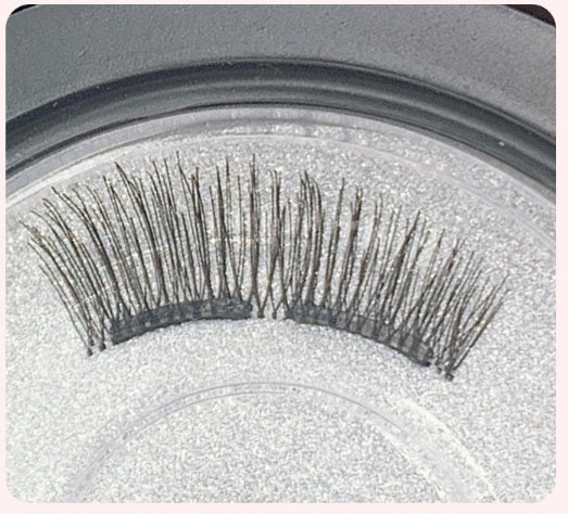 False eyelashes on a gray background