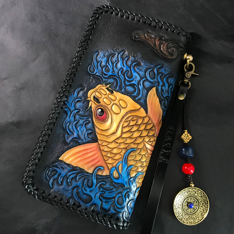 Handcrafted leather pouch with a fish design on a dark background