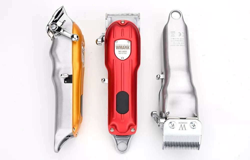 Three grooming tools including a clipper, trimmer, and shears on a white background