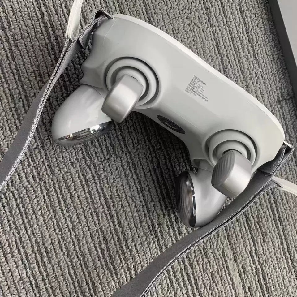 White handheld device with gray straps on a textured surface